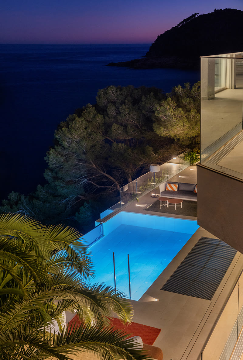 Pool and house after dark at Tamariu
