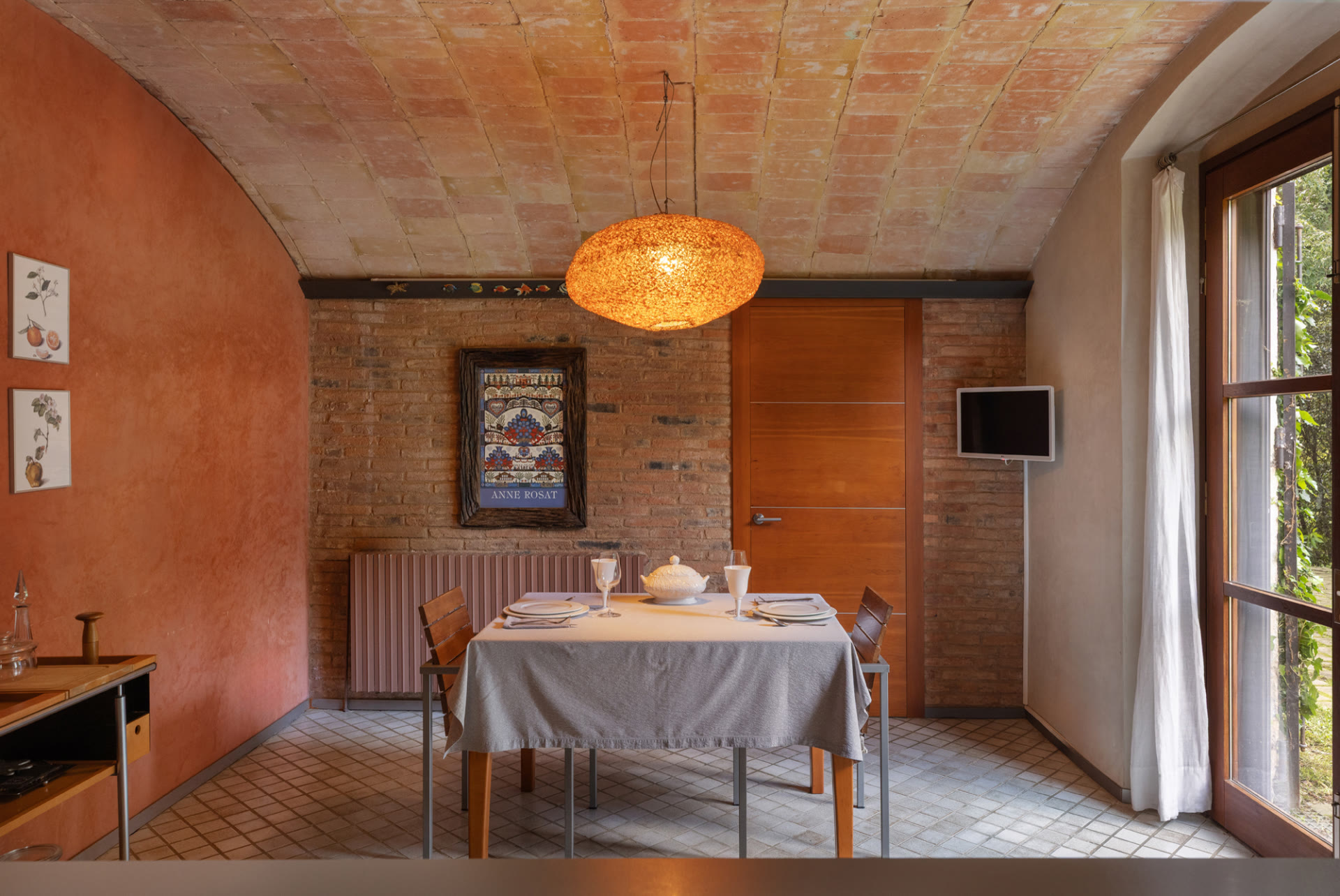 Dining room with brick vaulted ceiling at Mas Simon